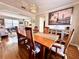 Well-lit dining room with wood floors, decorative lighting, and decorative buffet table at 1002 River Plantation Drive, Woodstock, GA 30188
