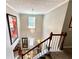 Spacious foyer features a charming chandelier, high ceilings and staircase to the second floor at 1002 River Plantation Drive, Woodstock, GA 30188