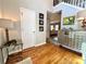 Foyer with hardwood floors, table, and light fixture at 1002 River Plantation Drive, Woodstock, GA 30188