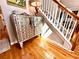 Foyer with hardwood floors, table, and staircase at 1002 River Plantation Drive, Woodstock, GA 30188