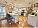 Bright kitchen with white cabinetry, breakfast bar, and stainless steel appliances at 1002 River Plantation Drive, Woodstock, GA 30188