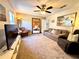 Inviting carpeted living room with a comfortable sofa, recliner, and natural light at 1002 River Plantation Drive, Woodstock, GA 30188