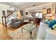 Inviting living room with open floor plan, beautiful hard wood floors and staircase at 1002 River Plantation Drive, Woodstock, GA 30188