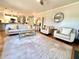 Expansive living room with hardwood floors, neutral decor, and open access to the kitchen at 1002 River Plantation Drive, Woodstock, GA 30188