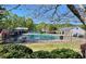 Community pool and playground area, offering a refreshing escape and recreational amenities at 1002 River Plantation Drive, Woodstock, GA 30188