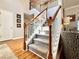 Carpeted staircase with wooden railing leading to the second floor at 1002 River Plantation Drive, Woodstock, GA 30188