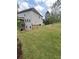 Expansive green backyard with privacy and landscaping including mulch beds at 3139 Hilltop Dr, Marietta, GA 30066