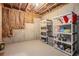 Unfinished basement area with exposed walls and utilitarian storage shelving at 3139 Hilltop Dr, Marietta, GA 30066
