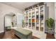 Walk-in closet featuring storage for handbags and shoes, complete with a bench and a mirror at 3139 Hilltop Dr, Marietta, GA 30066