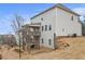 The rear exterior of the home shows a large backyard and upper and lower decks at 3139 Hilltop Dr, Marietta, GA 30066