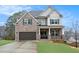 Charming brick home with a two-car garage, manicured lawn, and welcoming covered front porch at 3139 Hilltop Dr, Marietta, GA 30066