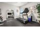 Bright home gym featuring a treadmill, free weights, rubber flooring, and wall art at 3139 Hilltop Dr, Marietta, GA 30066