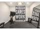 Compact home gym with stationary bike, workout mirror, and motivational banner at 3139 Hilltop Dr, Marietta, GA 30066