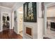 Hallway with hardwood flooring connecting to a laundry room, bathroom, and living area at 3139 Hilltop Dr, Marietta, GA 30066