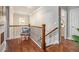 Upstairs hallway with decorative railing and hardwood floors at 3139 Hilltop Dr, Marietta, GA 30066