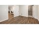 Hallway with wood floors leading to an office space and unfinished basement area at 3139 Hilltop Dr, Marietta, GA 30066