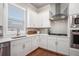 The kitchen features stainless steel appliances, gas cooktop, and white cabinets at 3139 Hilltop Dr, Marietta, GA 30066