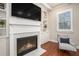 Living room featuring a fireplace with marble surround and custom built-in shelving at 3139 Hilltop Dr, Marietta, GA 30066