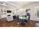 Elegant living room featuring a coffered ceiling, hardwood floors, fireplace, and stylish decor at 3139 Hilltop Dr, Marietta, GA 30066