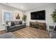 Inviting living room with a mounted TV, stylish sofas, and natural light at 3139 Hilltop Dr, Marietta, GA 30066