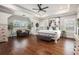 Spacious bedroom with tray ceilings, hardwood floors, plantation shutters and neutral decor at 3139 Hilltop Dr, Marietta, GA 30066