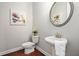 Charming powder room with pedestal sink, modern fixtures, and stylish decor at 3139 Hilltop Dr, Marietta, GA 30066