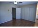 Bedroom featuring closets, a ceiling fan, neutral paint, laminate flooring and lots of space at 3338 York Pl, Decatur, GA 30032