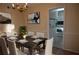 Cozy dining room featuring a dark wood table set for six, a chandelier, and view to the kitchen at 3338 York Pl, Decatur, GA 30032
