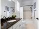Bathroom with granite countertop, undermount sink, and tiled shower/tub with elegant fixtures at 948 Saint Lyonn Cts, Marietta, GA 30068