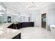 Spacious bathroom with dual sinks, dark cabinetry, marble countertops, statement mirrors and unique lighting at 948 Saint Lyonn Cts, Marietta, GA 30068