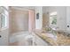 Bathroom featuring tile surround tub with shower, granite counters, and modern fixtures at 948 Saint Lyonn Cts, Marietta, GA 30068