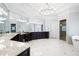 Luxurious bathroom with marble counters, unique lighting, and a glass enclosed shower, creates a spa-like experience at 948 Saint Lyonn Cts, Marietta, GA 30068