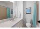 Bathroom featuring modern fixtures, a tub with shower, and white marble counters at 948 Saint Lyonn Cts, Marietta, GA 30068