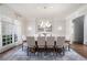 Elegant dining room with a large table, seating for ten, and stylish chandelier at 948 Saint Lyonn Cts, Marietta, GA 30068