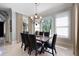 Bright dining room features hardwood floors, large windows and decorative light fixture at 948 Saint Lyonn Cts, Marietta, GA 30068