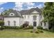 Beautiful home with manicured lawn, brick facade, lush landscaping and striking entrance at 948 Saint Lyonn Cts, Marietta, GA 30068