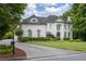Beautiful exterior view with a well-maintained lawn, hardscaped driveway, and inviting entrance at 948 Saint Lyonn Cts, Marietta, GA 30068