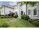 Stately home featuring a meticulously landscaped front yard, brick facade, and prominent entrance with pillars at 948 Saint Lyonn Cts, Marietta, GA 30068