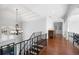 Second floor foyer with chandelier and hardwood floors at 948 Saint Lyonn Cts, Marietta, GA 30068