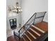 Grand foyer with high ceilings, staircase, chandelier, and front doors at 948 Saint Lyonn Cts, Marietta, GA 30068