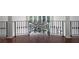 Second floor foyer with decorative railing and hardwood floors at 948 Saint Lyonn Cts, Marietta, GA 30068