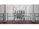 Bright foyer featuring iron railing detail, white columns, and hardwood flooring at 948 Saint Lyonn Cts, Marietta, GA 30068