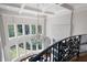 Elegant foyer with a high ceiling, large windows, a chandelier, and decorative railing at 948 Saint Lyonn Cts, Marietta, GA 30068