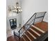 Grand foyer with hardwood staircase, chandelier, and double front doors at 948 Saint Lyonn Cts, Marietta, GA 30068