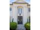 Grand front entrance featuring double doors, white columns, and a beautiful transom window at 948 Saint Lyonn Cts, Marietta, GA 30068