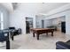 Spacious game room featuring a pool table, foosball, wet bar and beverage fridge at 948 Saint Lyonn Cts, Marietta, GA 30068