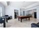 Well-appointed game room with pool table, foosball table, wet bar and kitchenette, ideal for entertaining guests at 948 Saint Lyonn Cts, Marietta, GA 30068