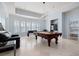 Game room with pool table, foosball, and a built in bar area with many windows for natural light at 948 Saint Lyonn Cts, Marietta, GA 30068