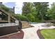 Backyard oasis with a hot tub, inground pool, stone patio, and outdoor seating for luxurious relaxation at 948 Saint Lyonn Cts, Marietta, GA 30068
