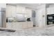 Kitchen showcasing white cabinets, granite counters, stainless appliances, and stylish tile backsplash at 948 Saint Lyonn Cts, Marietta, GA 30068